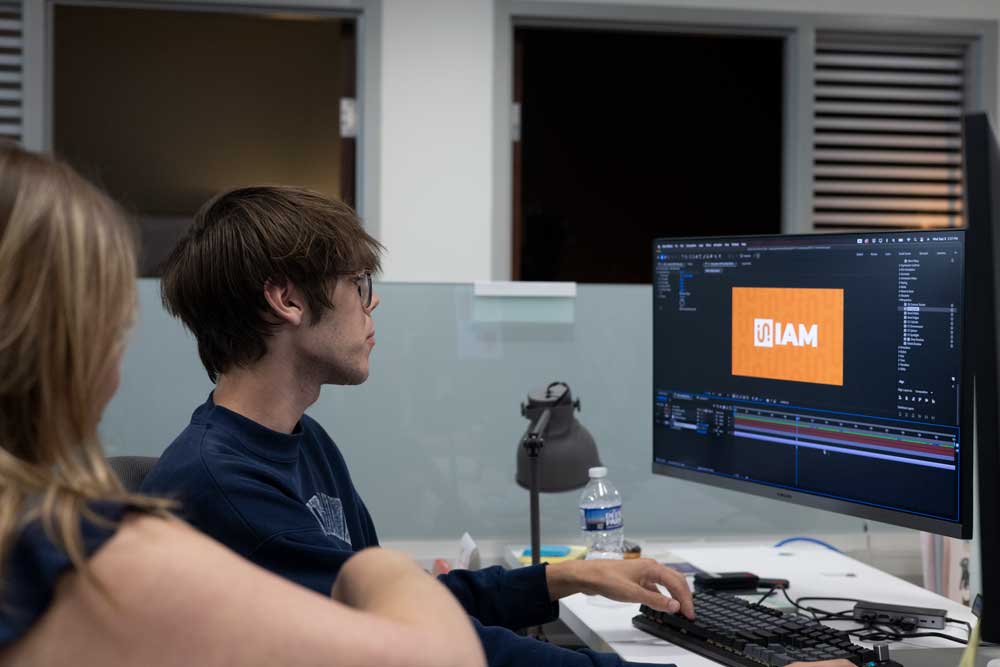 The team designing on a computer